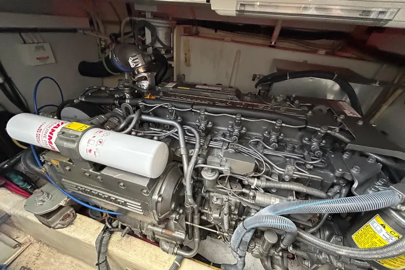 Slide: The Image of Engine compartment of a 2005 Sabre 38 boat, showcasing detailed mechanical components. - 18