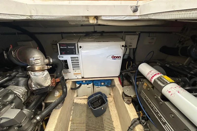 Slide: The Image of Engine room of a 2005 Sabre 38 with Onan Marine Genset and mechanical components. - 19