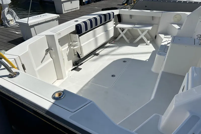 Slide: The Image of Spacious deck of a 2005 Sabre 38 boat with seating and storage. - 7