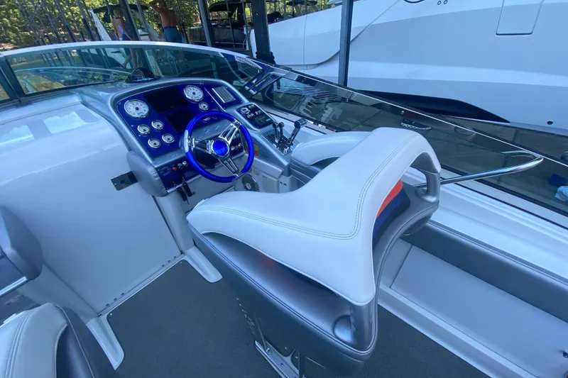 Slide: The Image of 2008 Formula 382 FASTech boat cockpit with modern steering and instrument panel. - 13