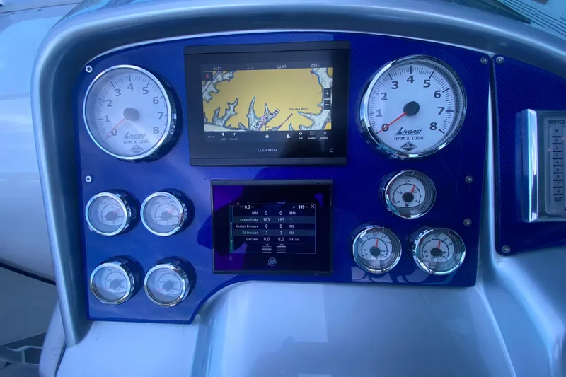 Slide: The Image of Dashboard of a 2008 Formula 382 FASTech boat with gauges and Garmin display. - 16
