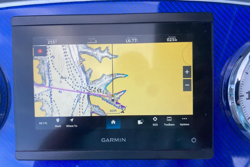 Slide: The Image of Garmin GPS display on 2008 Formula 382 FASTech boat, showing nautical map and navigation details. - 18