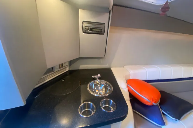 Slide: The Image of 2008 Formula 382 FASTech cabin interior with sink, stereo, and seating area. - 24