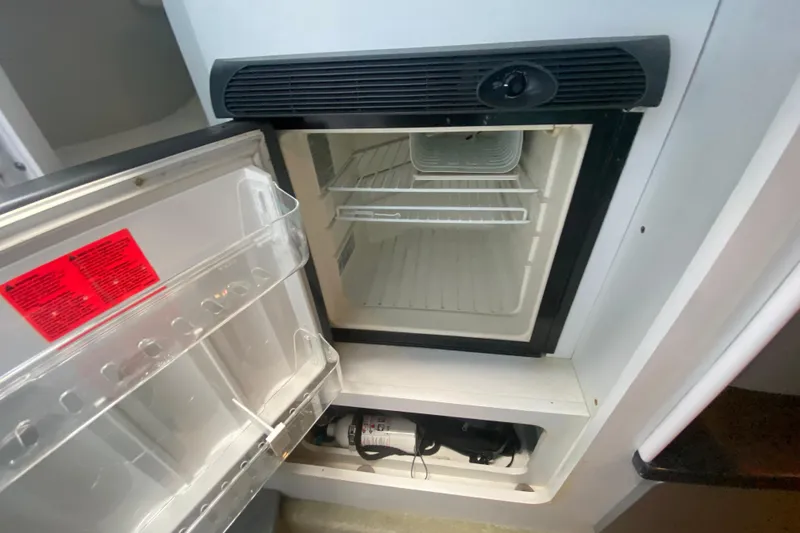 Slide: The Image of Open refrigerator inside 2008 Formula 382 FASTech boat cabin. - 28