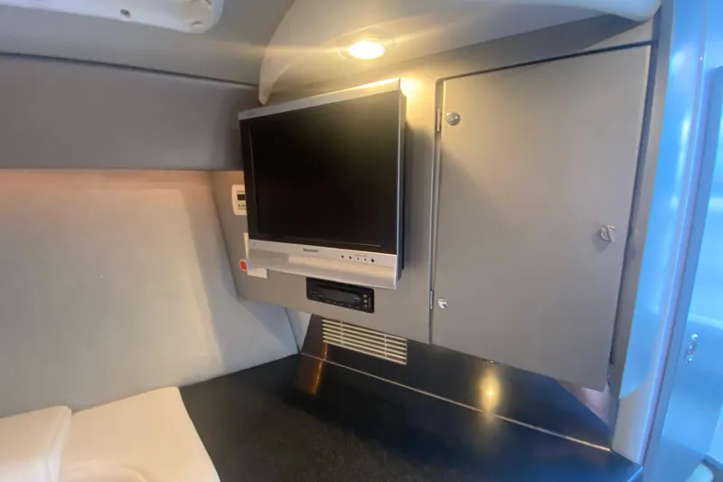 Slide: The Image of 2008 Formula 382 FASTech cabin interior with TV and storage cabinet. - 30
