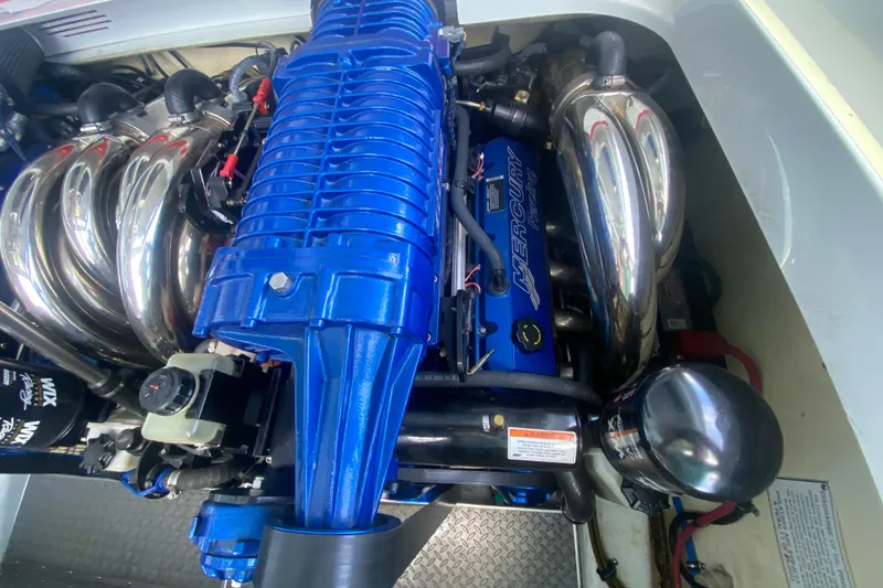 Slide: The Image of 2008 Formula 382 FASTech engine with blue Mercury Racing components and chrome headers. - 33