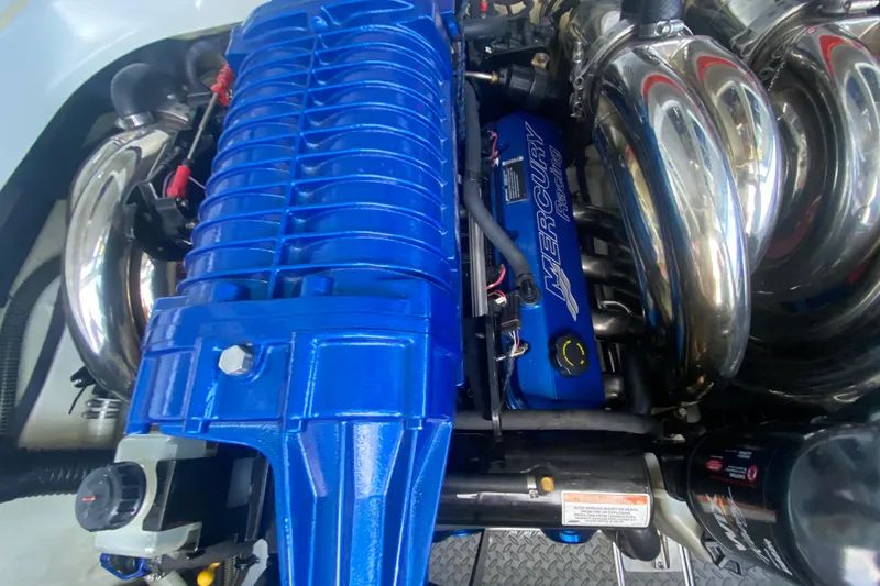 Slide: The Image of 2008 Formula 382 FASTech engine with blue Mercury Racing components and chrome exhaust. - 34
