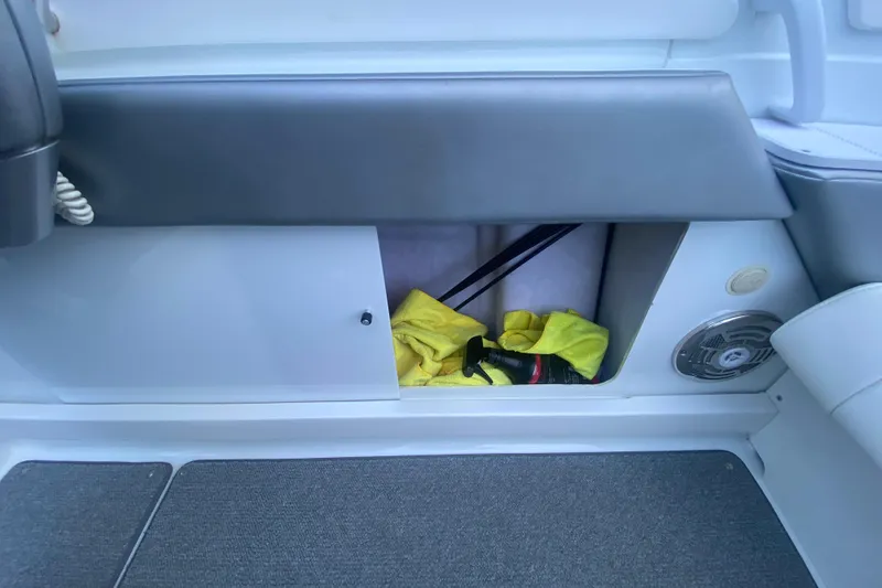 Slide: The Image of Storage compartment in 2008 Formula 382 FASTech boat with cleaning supplies and speaker. - 9