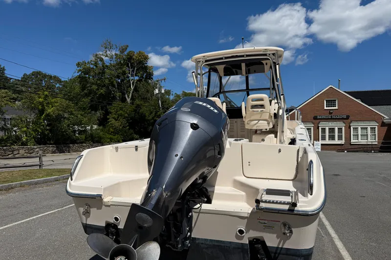 Slide: The Image of 2015 Grady-White Journey 258 boat with Yamaha outboard motor in a parking lot. - 2