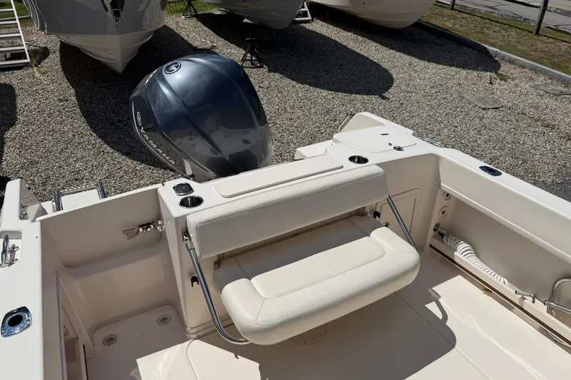Slide: The Image of 2015 Grady-White Journey 258 boat interior with seating and outboard motor. - 9