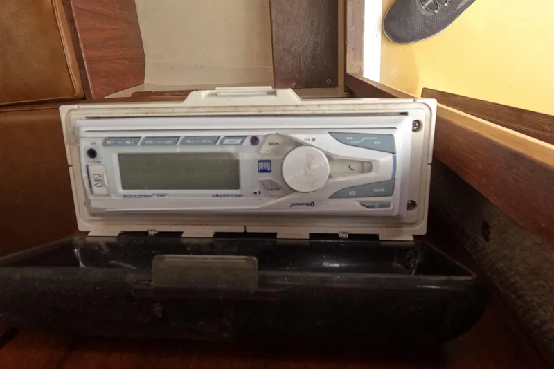 Slide: The Image of Vintage Mako 228 boat radio from 1982, mounted in a wooden interior. - 12