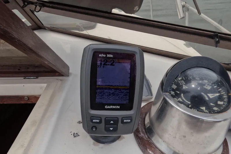 Slide: The Image of Garmin echo 300c fishfinder and compass on 1982 Mako 228 boat dashboard. - 22