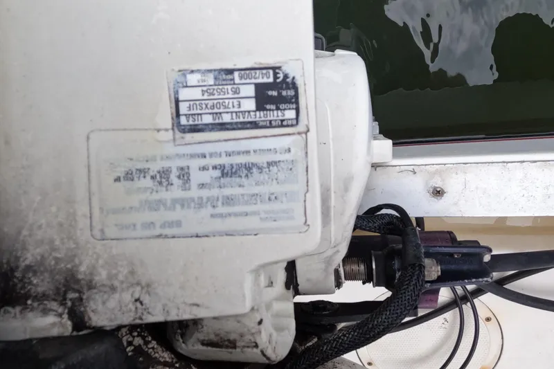 Slide: The Image of Close-up of a 1982 Mako 228 boat engine with visible serial numbers. - 7