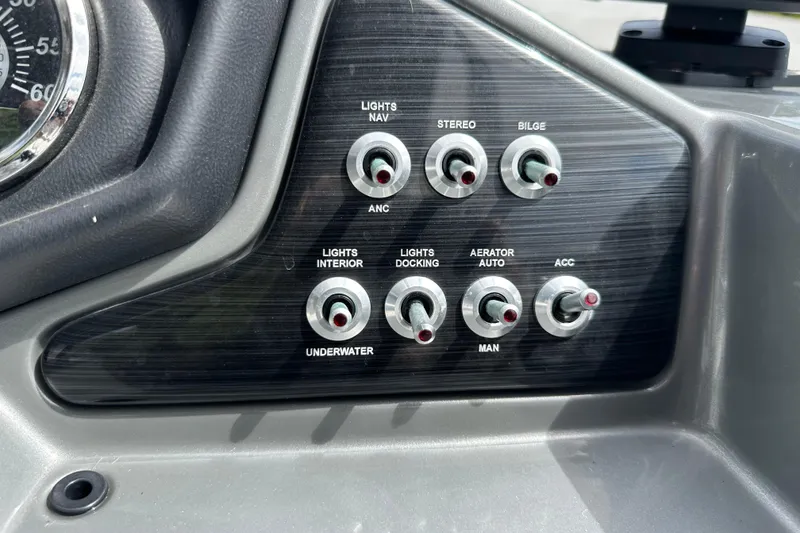 Slide: The Image of Control panel of 2019 Lowe SS270 boat with various switches for lights and accessories. - 11