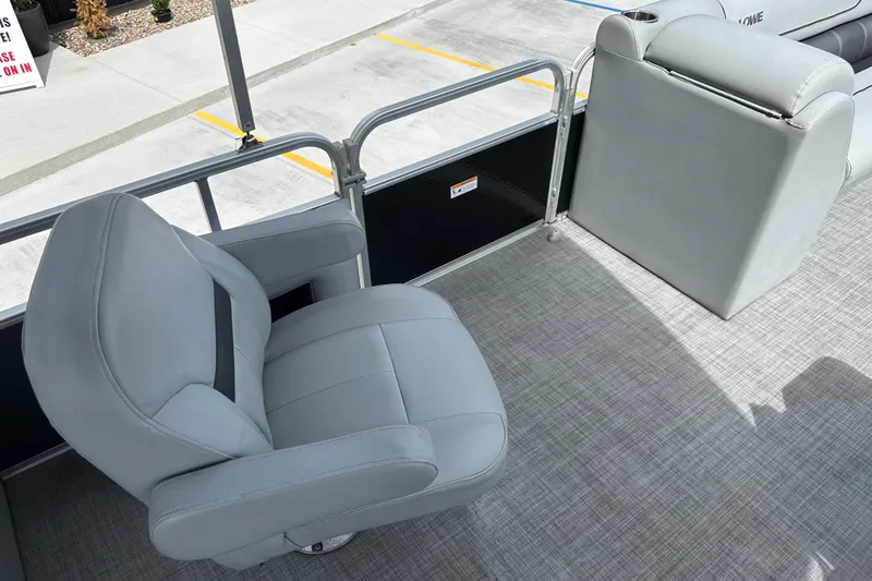 Slide: The Image of 2019 Lowe SS270 Extended Walk-Thru boat interior with gray seating and flooring. - 19