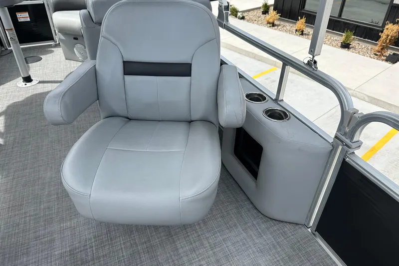 Slide: The Image of 2019 Lowe SS270 boat interior with gray captain's chair and cup holders. - 22