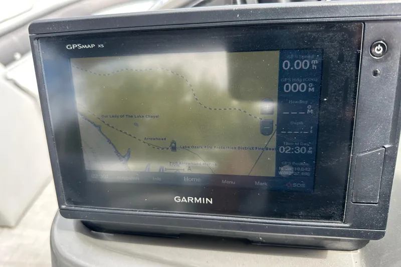 Slide: The Image of Garmin GPSMAP XS on 2019 Lowe SS270 boat, displaying navigation map and data. - 9