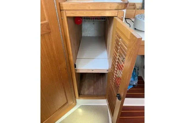 Slide: The Image of Open wooden cabinet in 2000 Catalina 34 Mk II sailboat interior. - 14