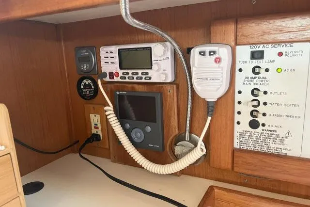 Slide: The Image of Control panel of a 2000 Catalina 34 Mk II sailboat with navigation and communication equipment. - 15