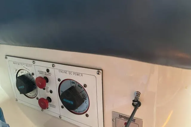 Slide: The Image of Control panel of a 2000 Catalina 34 Mk II sailboat, featuring battery and power switches. - 17