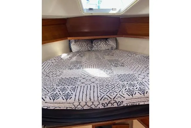 Slide: The Image of Cozy cabin interior of 2000 Catalina 34 Mk II with patterned bedding. - 20