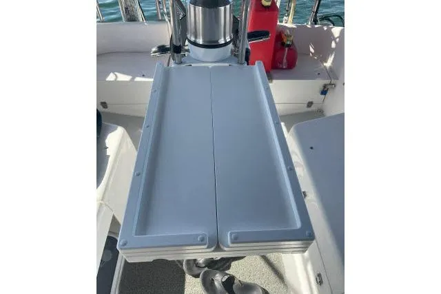 Slide: The Image of Cockpit table on a 2000 Catalina 34 Mk II sailboat, with steering wheel visible. - 24