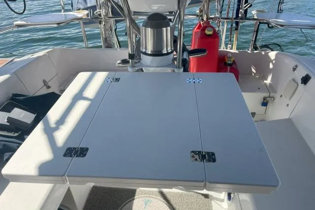 Slide: The Image of Cockpit of 2000 Catalina 34 Mk II sailboat with foldable table and steering wheel. - 25