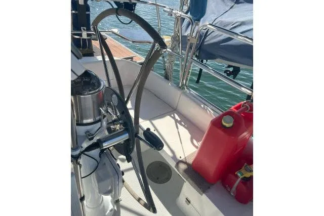 Slide: The Image of Cockpit of 2000 Catalina 34 Mk II sailboat with steering wheel and fuel containers. - 26