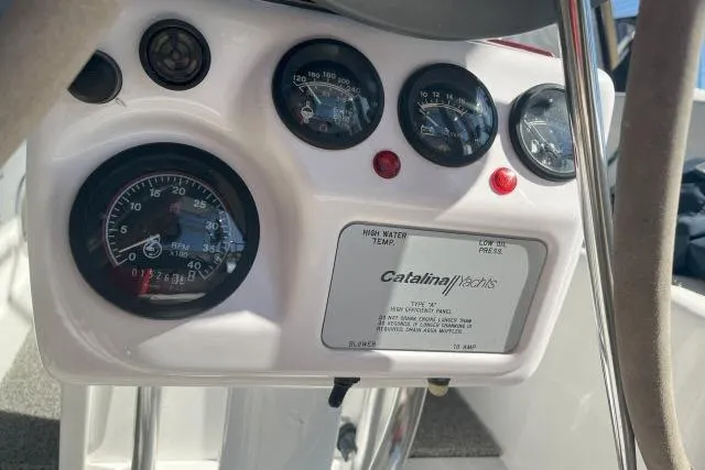 Slide: The Image of Control panel of a 2000 Catalina 34 Mk II yacht with gauges and indicators. - 28