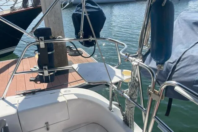 Slide: The Image of Catalina 34 Mk II sailboat docked, showcasing deck and railing, year 2000 model. - 29