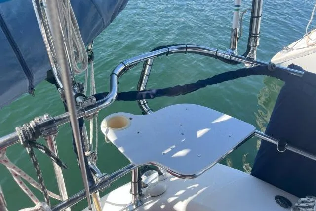 Slide: The Image of Catalina 34 Mk II sailboat stern view, featuring stainless steel railings and a small platform. - 30