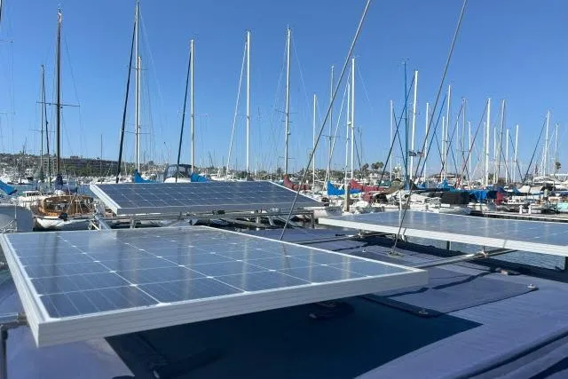 Slide: The Image of Solar panels on a 2000 Catalina 34 Mk II sailboat in a marina. - 32