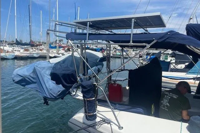 Slide: The Image of Catalina 34 Mk II sailboat, 2000 model, docked with solar panels and covered equipment. - 41