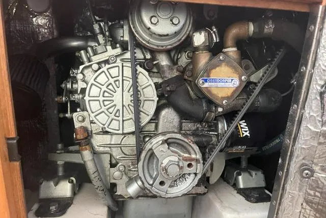 Slide: The Image of Engine compartment of a 2000 Catalina 34 Mk II sailboat, showcasing mechanical components. - 44