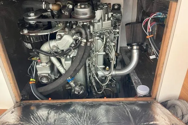 Slide: The Image of Engine compartment of a 2000 Catalina 34 Mk II sailboat, showcasing detailed mechanical components. - 45