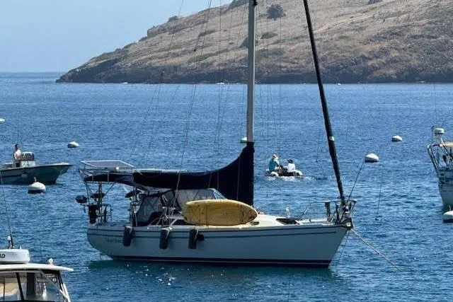Slide: The Image of Catalina 34 Mk II sailboat anchored in a serene bay, 2000 model. - 47