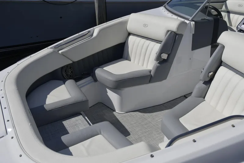 Slide: The Image of 2020 Cobalt 23SC boat interior with gray and white seating, modern design. - 15