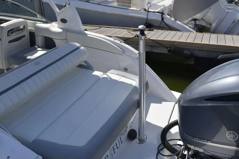 Slide: The Image of 2020 Cobalt 23SC boat interior with seating and Yamaha outboard motor. - 6