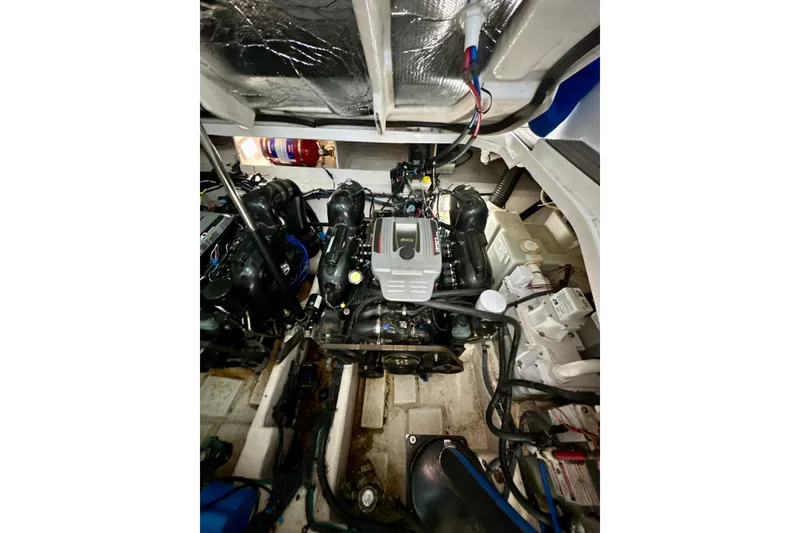 Slide: The Image of Engine compartment of 2012 Sea Ray 330 Sundancer, showcasing detailed mechanical components. - 17
