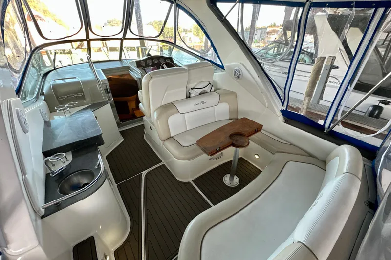 Slide: The Image of Interior of 2012 Sea Ray 330 Sundancer yacht with seating and helm. - 2
