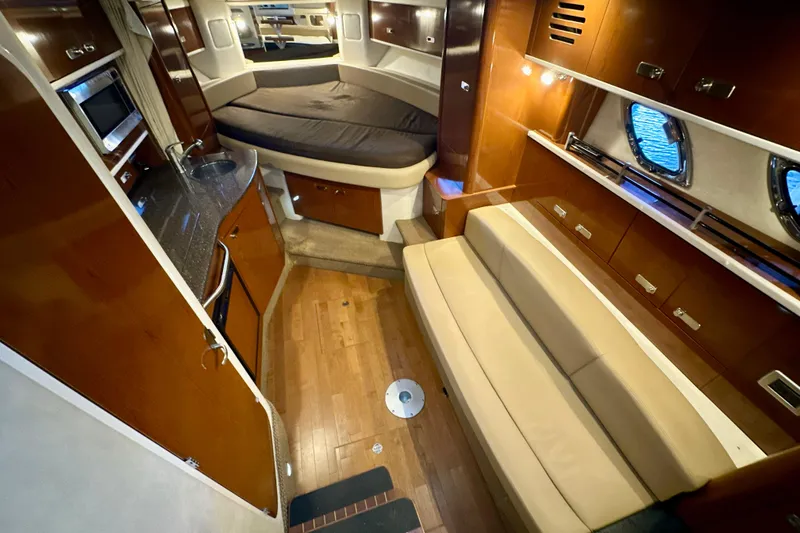Slide: The Image of Luxurious interior of 2012 Sea Ray 330 Sundancer yacht with cozy seating and modern amenities. - 7