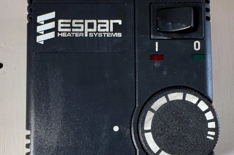 Slide: The Image of 1982 Jarvis Newman Flybridge Cruiser engine compartment with yellow engine and red hoses. - 25