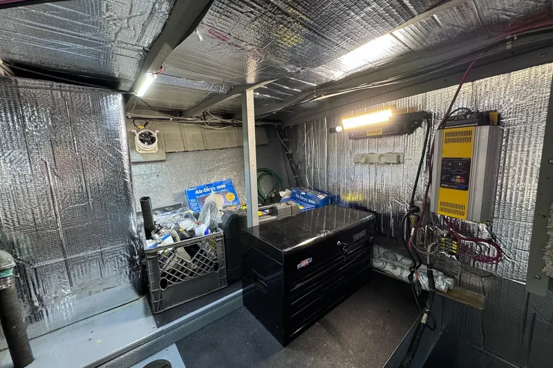 Slide: The Image of Interior of 1981 Tollycraft 43 Motor Yacht with cozy seating and wooden table. - 14