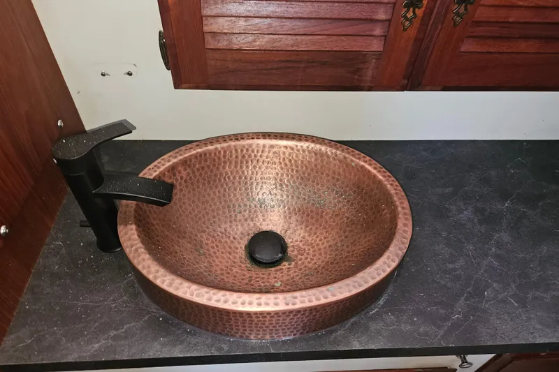 Slide: The Image of Copper sink with black faucet on Tollycraft 43 Motor Yacht, 1981 model. - 36