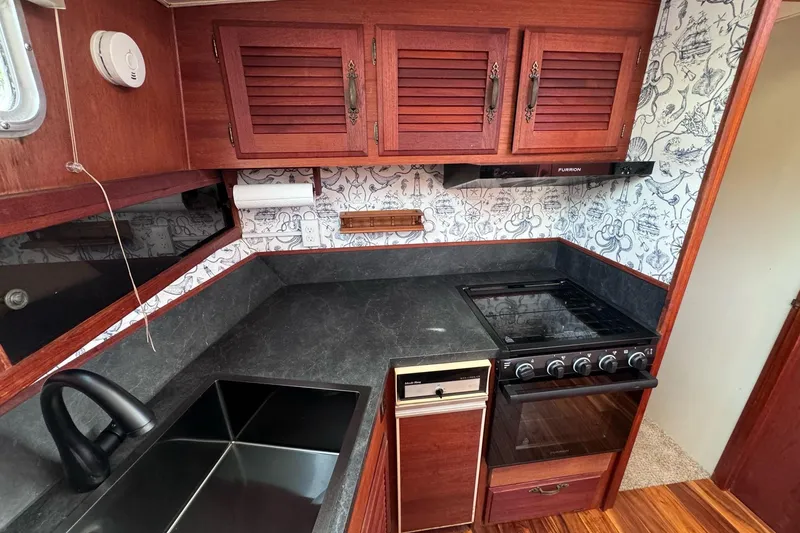 Slide: The Image of 1981 Tollycraft 43 Motor Yacht stern with swim platform and ladder. - 4