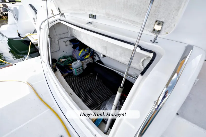 Slide: The Image of 2003 Tiara 4000 EXPRESS boat with spacious trunk storage open at the dock. - 17