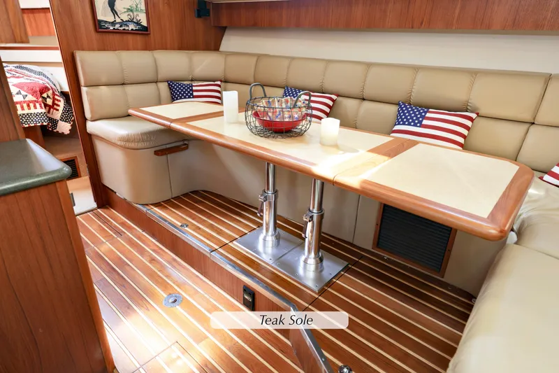 Slide: The Image of Luxurious 2003 Tiara 4000 EXPRESS yacht interior with teak flooring and American-themed decor. - 22