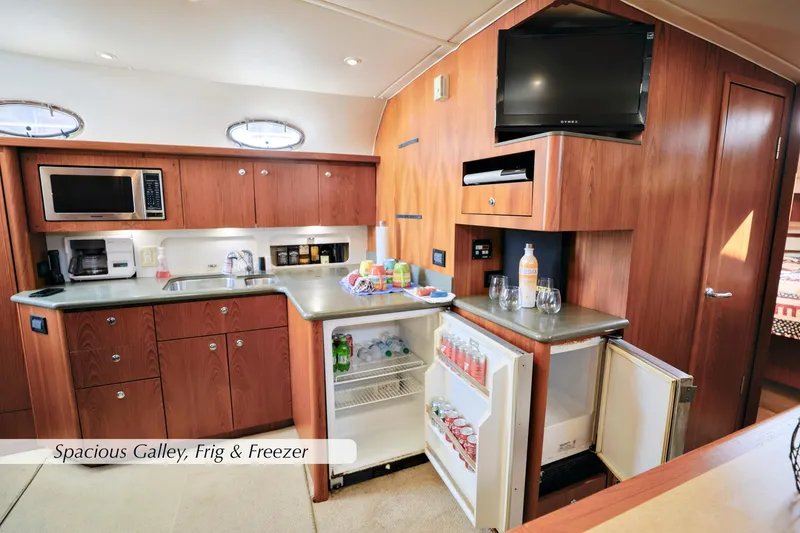 Slide: The Image of Spacious galley in 2003 Tiara Yachts 4000 Express with fridge, freezer, and microwave. - 24