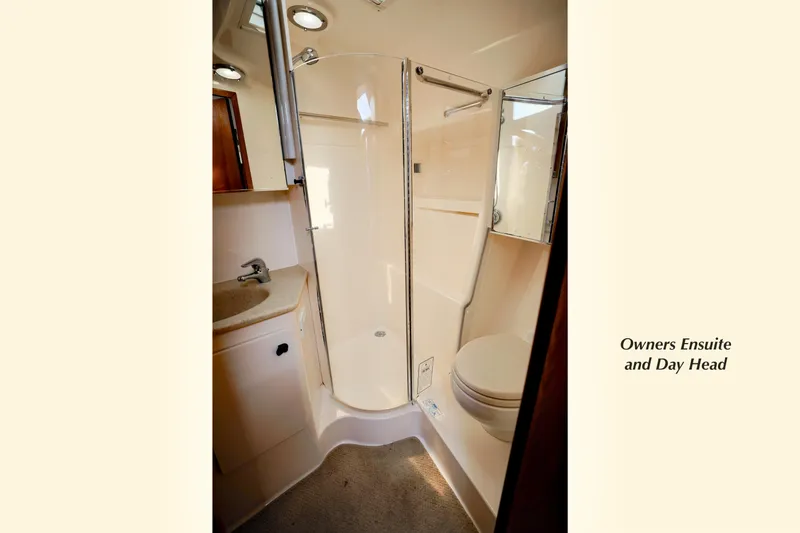 Slide: The Image of 2003 Tiara Yachts 4000 Express owner's ensuite bathroom with shower and sink. - 26