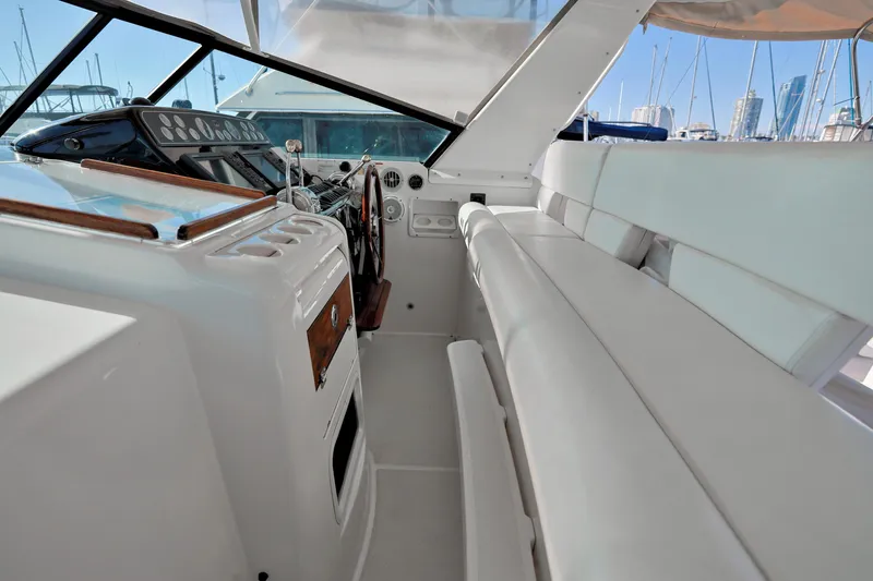 Slide: The Image of 2003 Tiara 4000 EXPRESS yacht interior with helm and seating area. - 7